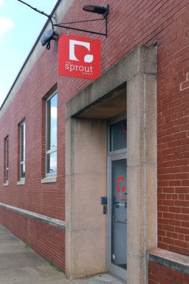 the sprout school hanging outdoor signage