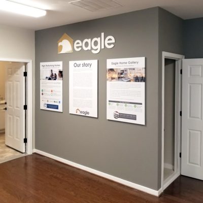 informational panels and dimensional logo displayed in show room