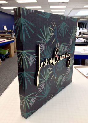 dimensional lettering with gold facer and printed panel backing