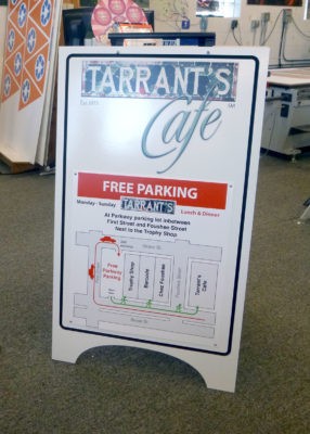 a-frame sidewalk sign for tarrant's cafe front