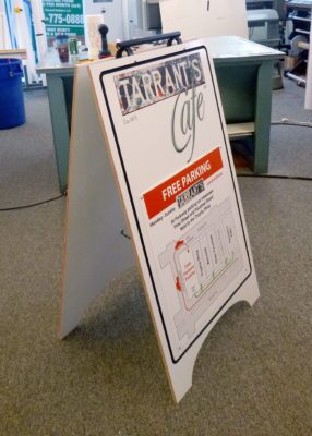 a-frame sidewalk sign for tarrant's cafe