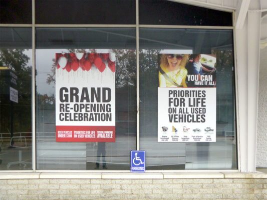 adhesive vinyl posters on window