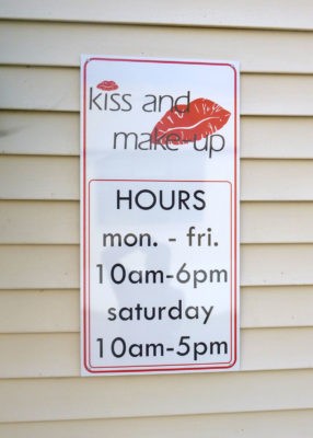 aluminum outdoor signage on side of building