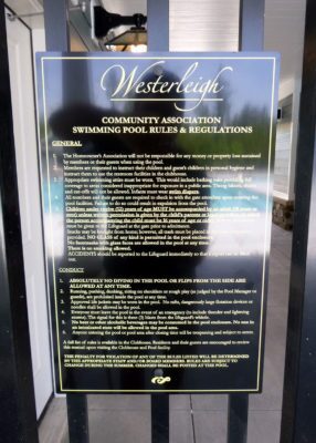 rules signage attached to fence