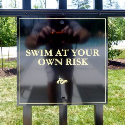 swim at your own risk sign