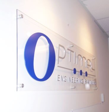 dimensional lettering attached to acrylic panel