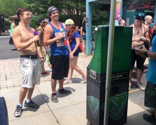 people enjoying kiosk at event