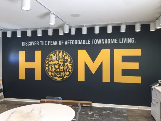 custom cut vinyl lettering and acrylic circle with wooden pieces