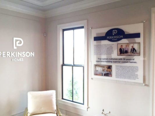 printed acrylic panel and dimensional metal lettering