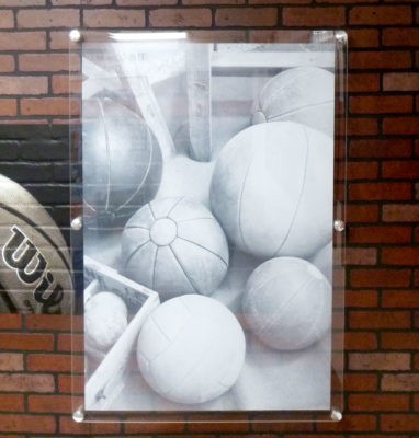 sports reverse printed acrylic with metal standoffs