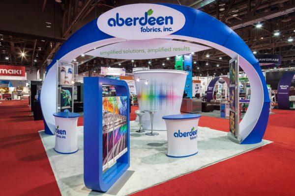tradeshow display with podiums and arch