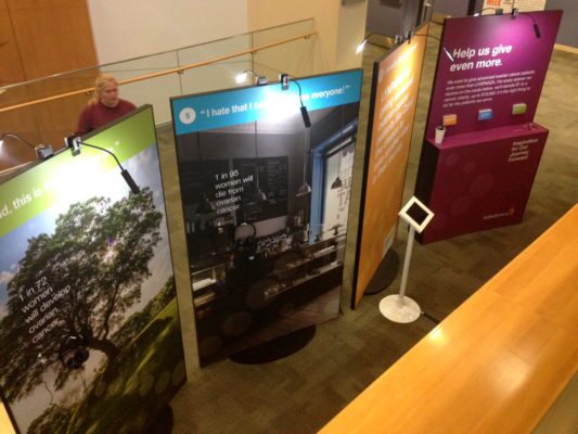 printed informational display stands with lighting