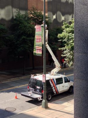 bucket truck pole banner installation