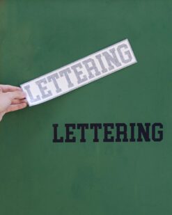 cut lettering on green wall